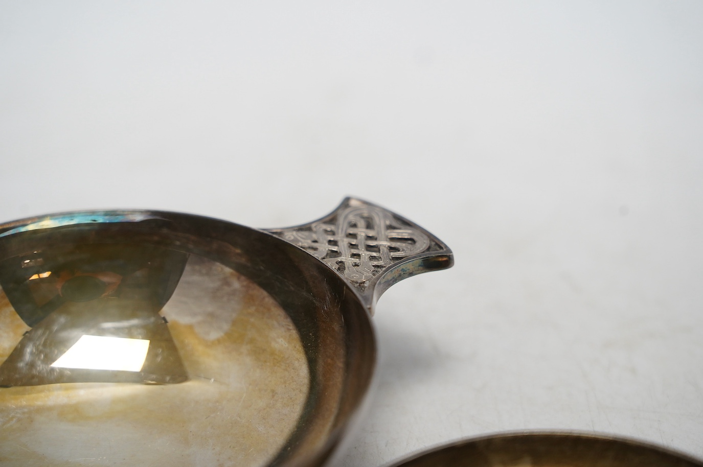 A modern Scottish silver Quaich, Francis Howard Ltd, Edinburgh, 2000, 14.3cm, together with a modern silver taste vin, 8.1oz. Condition - good